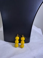 Yellow braided choker necklace set with fringes and matching earrings