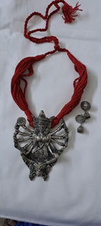 Red thread necklace with oxidised silver durga pendant