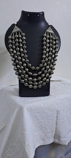 Multi-layered silver oxidised beads necklace .