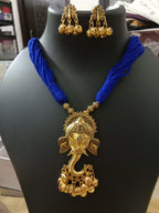 Oxidised golden ganesha traditional pendant and matching earrings.