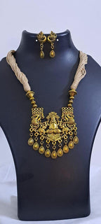 Off white thread necklace with Golden oxidised traditional pendant