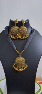 Grey thread necklace with Golden oxidised traditional pendant