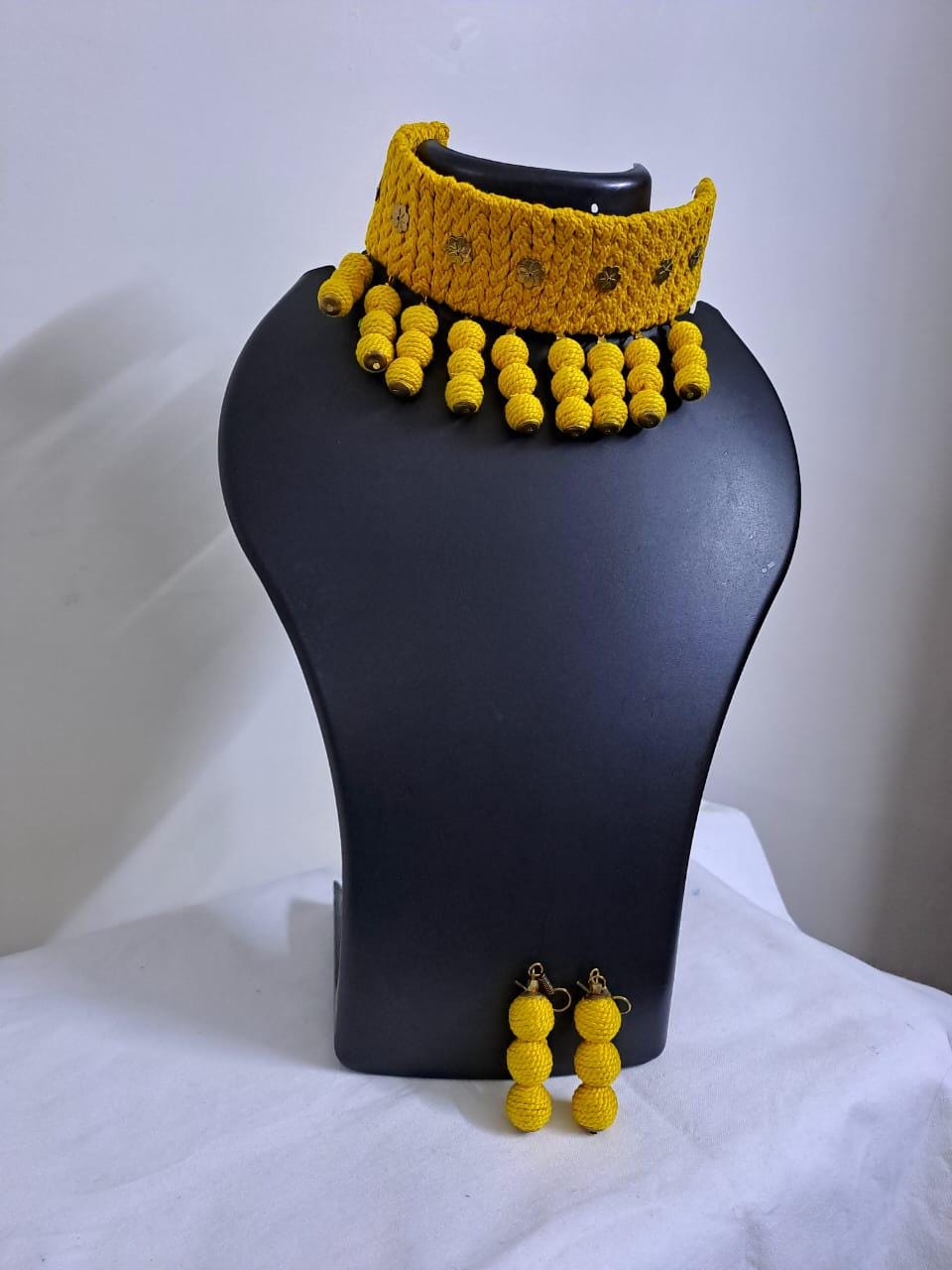 Yellow braided choker necklace set with fringes and matching earrings