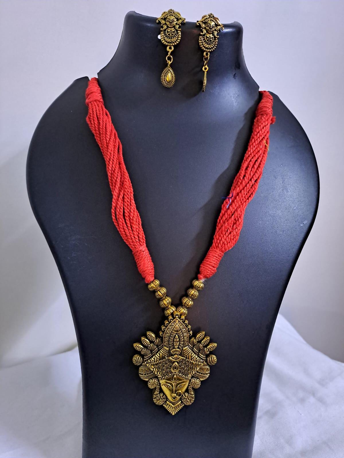 Red thread jewellery set with golden durga pendant n matching earrings