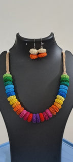 Exclusive multi coloured crochet necklace with colouful matching earrings.