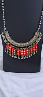 Exclusive necklace with silver oxidised big oval pendant with glass beads fringes and matching earrings.
