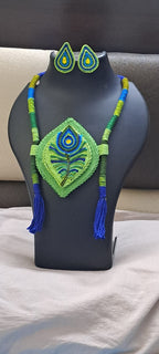 Thread necklace depicting peacock feather with shades of green. Exclusively for Janmashtami
