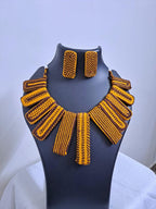 Exclusive brown n yellow thread necklace with rectangle shape thread beads and matching earrings.