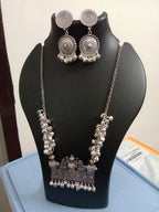 Oxidised silver chain with traditional pendant and matching earrings.
