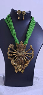 Green thread necklace with oxidised golden durga pendant