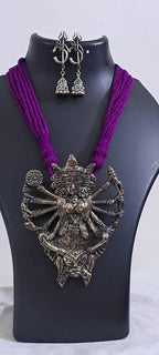 purple thread necklace with oxidised golden durga pendant