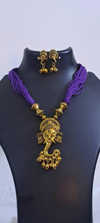 Purple thread necklace with Golden oxidised traditional pendant