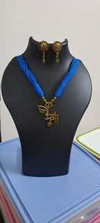 Blue thread necklace with oxidised golden durga pendant