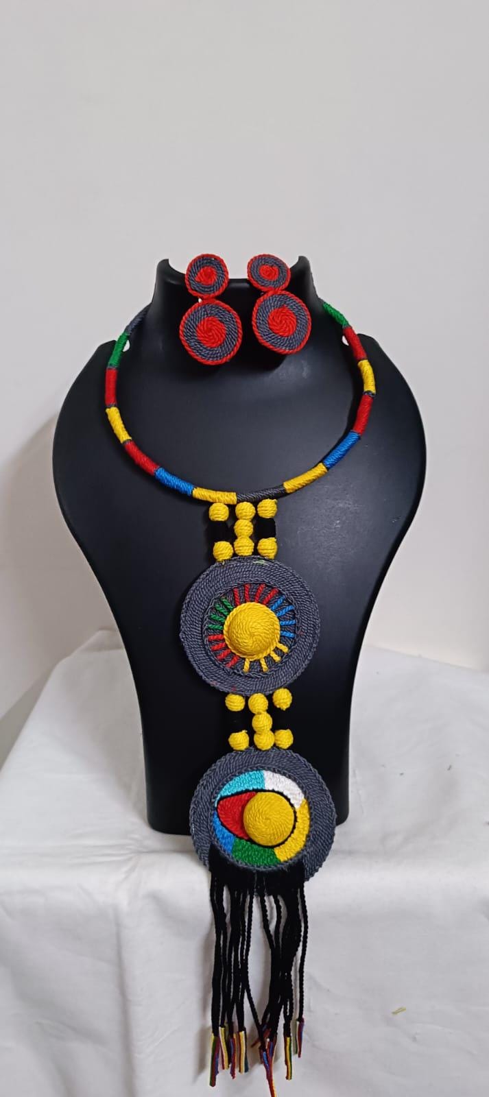 Exclusive multicoloured hasuli thread necklace set with round thread pendant n matching earrings