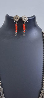 Exclusive necklace with silver oxidised big oval pendant with glass beads fringes and matching earrings.