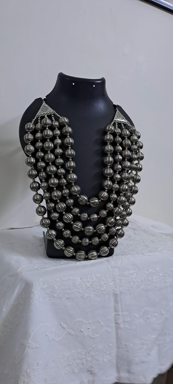 Multi-layered silver oxidised beads necklace .