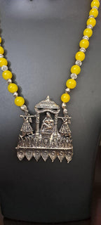 Yellow glass beads necklace with oxidised silver pendant