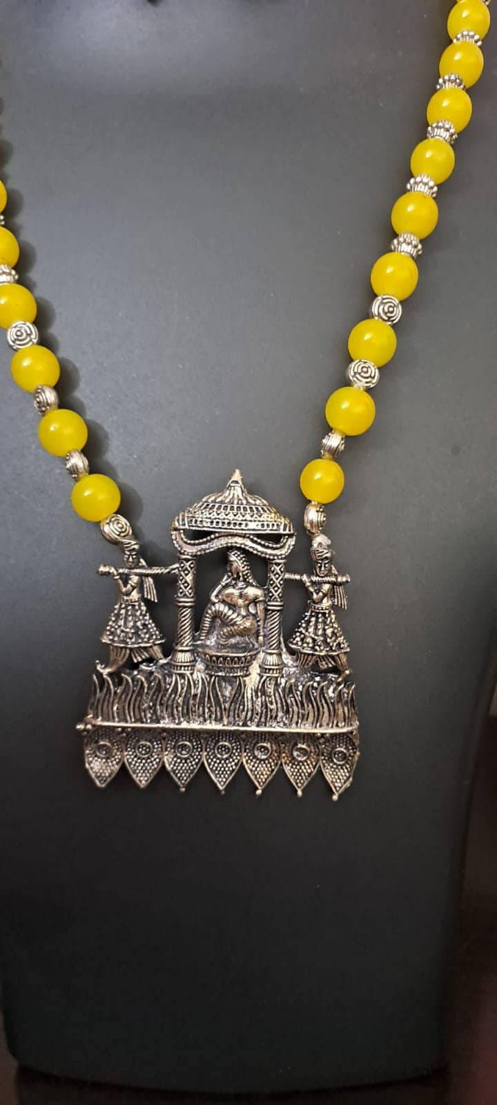 Yellow glass beads necklace with oxidised silver pendant
