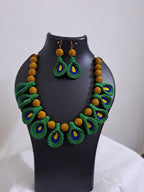 Green n yellow thread necklace with matching thread earrings.