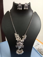 Oxidised silver chain with traditional pendant and matching earrings.