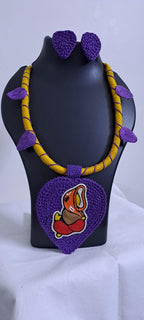 Exclusive yellow and purple thread necklace with leaf shaped  Ganesha thread pendant and matching earrings.