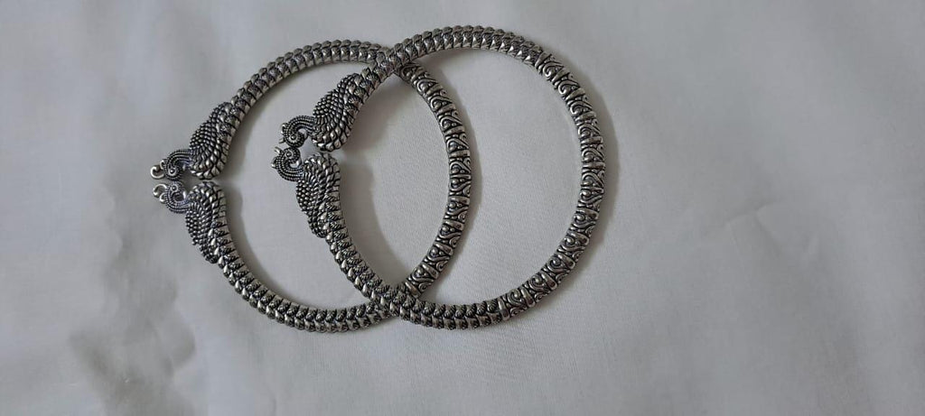 Traditional silver oxidised bangles with peacock