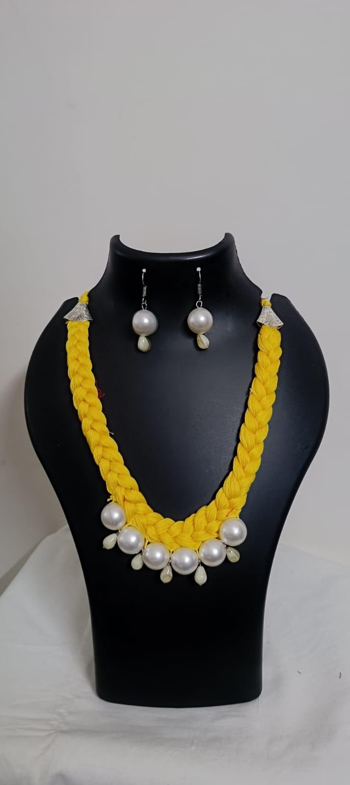 Yellow  braided thread necklace with pearl n pearl danglers