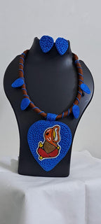 Exclusive brown and blue thread necklace with leaf shaped  Ganesha thread pendant and matching earrings.
