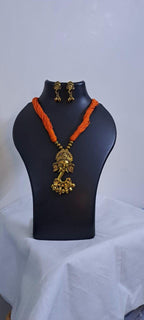 Orange thread necklace with Golden oxidised traditional pendant
