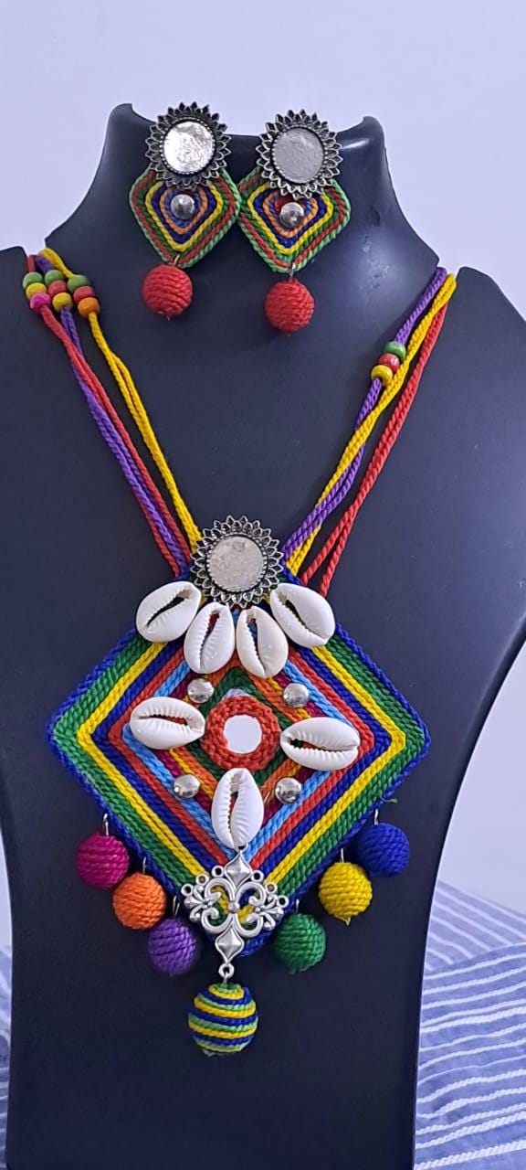 Exclusive multicoloured thread necklace set with shell n thread pendant n matching earrings