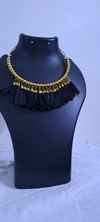 Golden neckband with black silk thread fringes and matching earrings