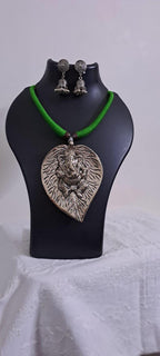 Green thread necklace with silver oxidised ganesha pendant