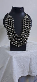 Multi-layered silver oxidised beads necklace .