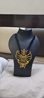 Black thread necklace with oxidised golden durga pendant