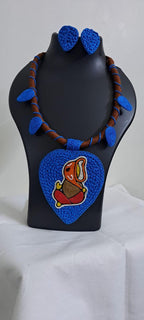 Exclusive brown and blue thread necklace with leaf shaped  Ganesha thread pendant and matching earrings.