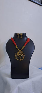Red thread necklace with Golden oxidised traditional pendant