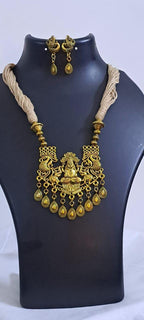 Off white thread necklace with Golden oxidised traditional pendant