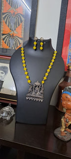 Yellow glass beads necklace with oxidised silver pendant