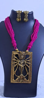 Pink thread necklace with oxidised golden durga pendant
