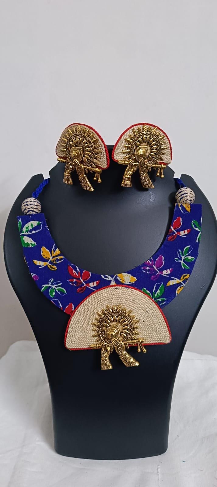 Unique fabric n thread necklace set with golden oxidised pendant and matching earrings