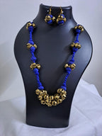 Blue thread necklace with trinkets n matching earrings