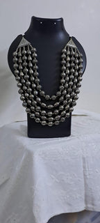 Multi-layered silver oxidised beads necklace .