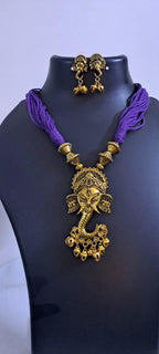Purple thread necklace with Golden oxidised traditional pendant