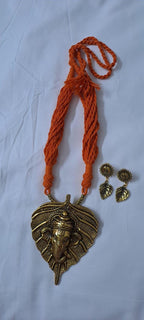 Orange thread necklace with golden oxidised ganesha pendant