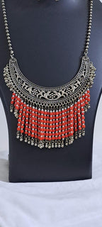 Exclusive necklace with silver oxidised big oval pendant with glass beads fringes and matching earrings.