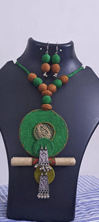 Exclusive green n brown thread beads necklace set with round thread n silver oxidised pendant n matching earrings