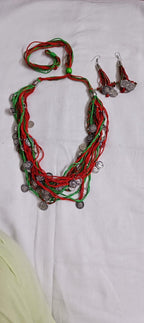 Exclusive multi-coloured and multi-layered thread necklace with silver oxidised charms
