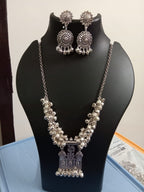 Oxidised silver chain with traditional pendant and matching earrings.