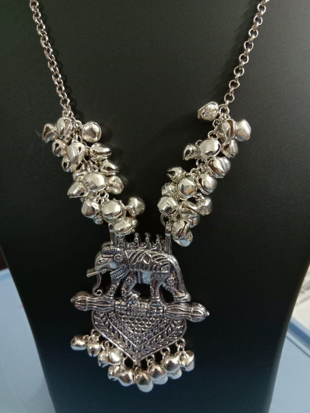 Oxidised silver chain with traditional pendant and matching earrings.