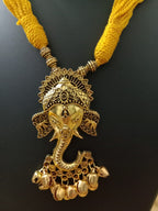 Oxidised golden ganesha traditional pendant and matching earrings.